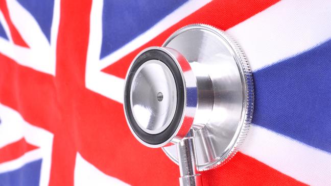 A doctor's stethoscope rests on a Union Jack to symbolise the current state of health of the UK and the NHS.